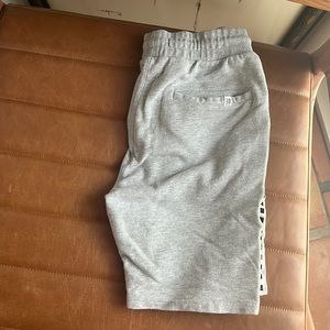 grey shorts with checkered details on sides